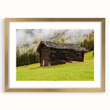 Textured abstract art print depicting the Adelaide skyline, in muted gold and blue tones, framed with a gold mat.