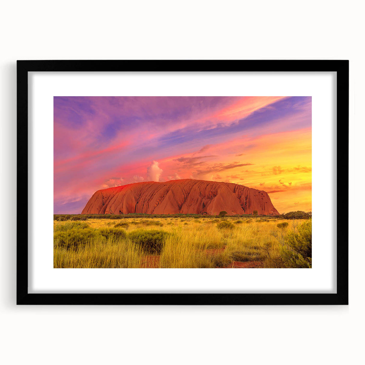 Extra large abstract art print of Ayers Rock in colorful, textured style, framed with a black mat.