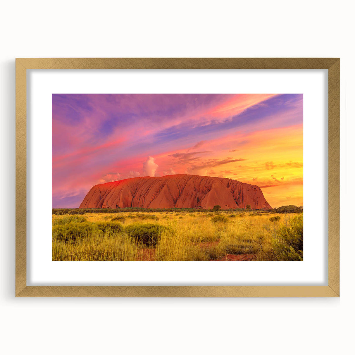 Textured art print of Ayers Rock in abstract style, using earth tones on a gold-framed mat, suitable for bedroom art.