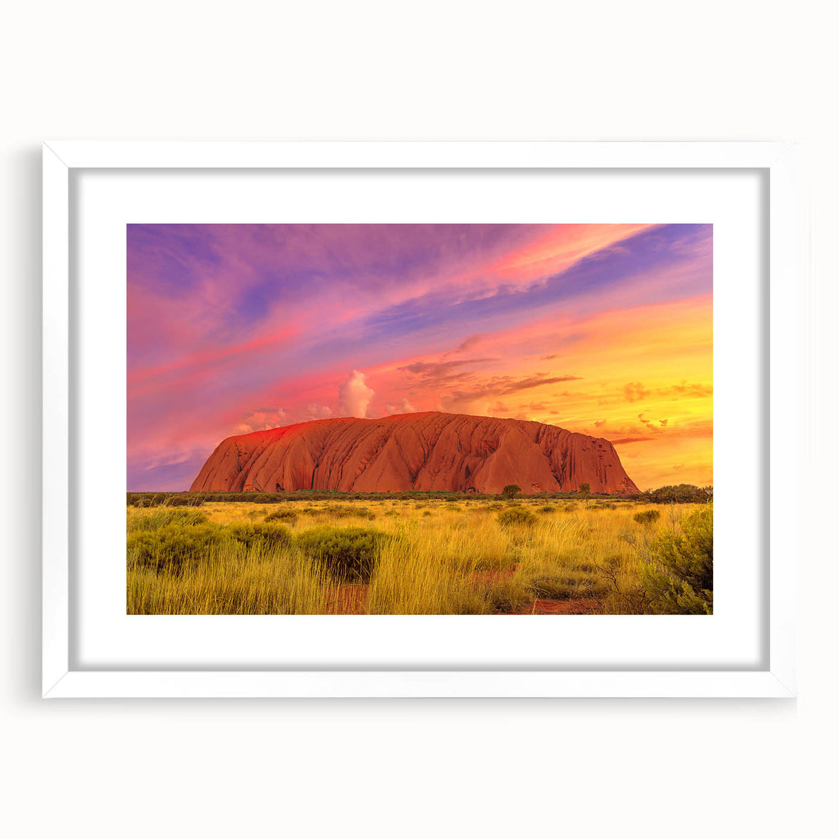Extra large abstract art print of Ayers Rock in textured orange and brown hues, framed in white, ideal for living room decor.