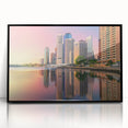 Large abstract wall art depicting the Brisbane skyline in muted gray and blue tones, framed in black acrylic.