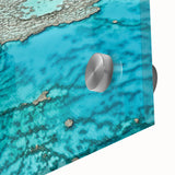 Large abstract depiction of the Great Barrier Reef in vibrant blues and greens on acrylic glass, ideal for dining room art.