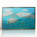 Mid-century modernist art depicting the Great Barrier Reef in vibrant blue and green tones on a framed acrylic print.