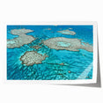 Rolled print of the Great Barrier Reef in vibrant blue and green tones, suitable for dining room or bathroom wall art.