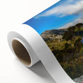Art deco poster of Tasmania scenery in muted green and blue tones on rolled canvas, ideal for nursery wall art.