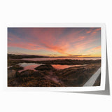 Rolled print of New Brunswick scenery with lush greenery and water, in soft green and blue tones.