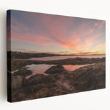 Scenic view of New Brunswick on a stretched canvas, featuring lush green landscapes and blue skies.