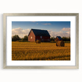 Textured art print of an abstract landscape in muted earth tones, framed in silver, ideal for bedroom art.