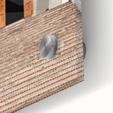 Large abstract wall art featuring a Caribbean scenery in muted blues and greens on acrylic glass.