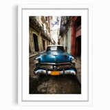 Textured abstract art print depicting Caribbean scenery in vibrant blues and greens, framed with a white mat.