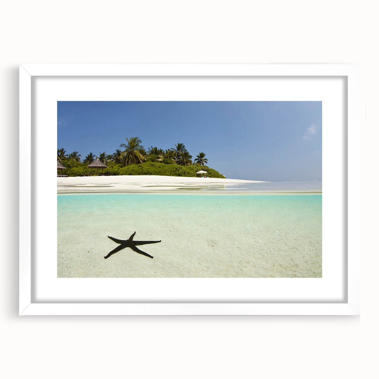 Textured abstract art print of a Caribbean seascape in serene blue tones, framed with a white mat.
