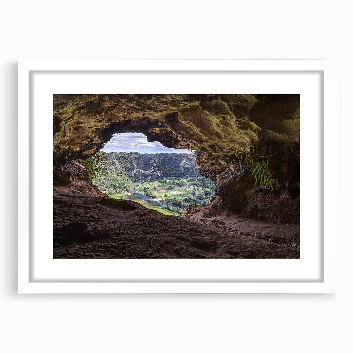 Textured abstract art print of Caribbean scenery in muted blue and green tones, framed with a white mat.