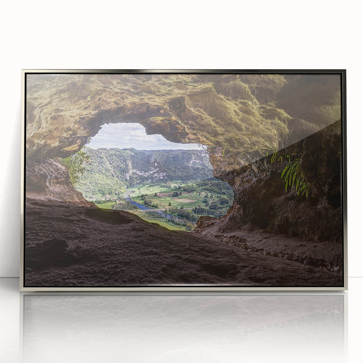 Art deco poster of a Caribbean scenery with vibrant blue and green tones on a silver-framed acrylic print.