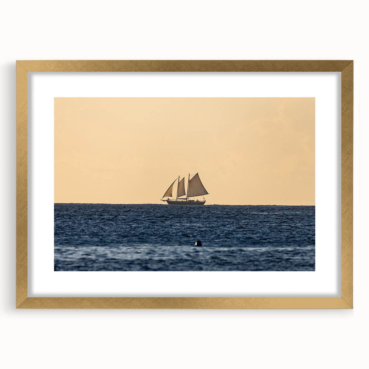 Abstract art print of Caribbean scenery in muted blue and green tones, framed in gold, suitable for dining room decor.