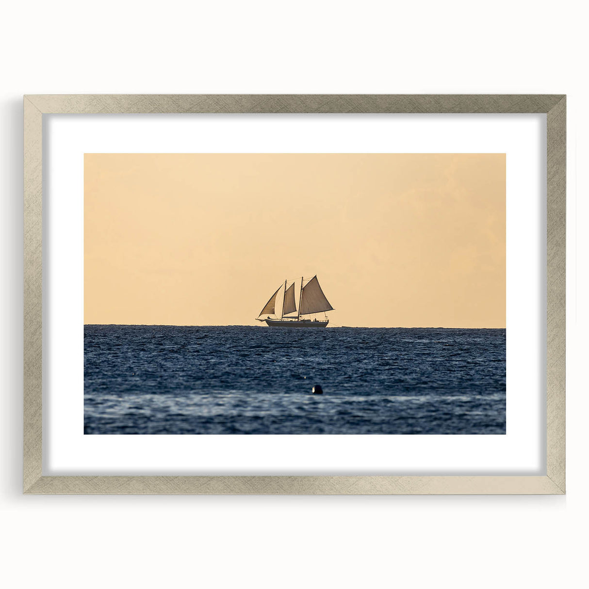 Extra large abstract art print of Caribbean scenery in muted blue and green tones on a textured canvas, framed in silver.