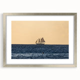 Extra large abstract art print of Caribbean scenery in muted blue and green tones on a textured canvas, framed in silver.