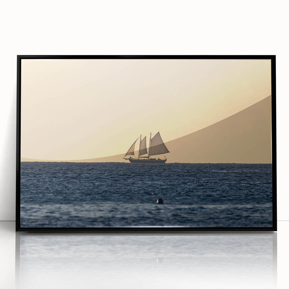 Large abstract wall art featuring a Caribbean scenery in muted blues and greens, acrylic print in a black frame.