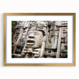 Extra large abstract art print of Central American scenery in gold frame, featuring textured blue and green hues.