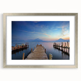 Textured abstract art print of a Central American landscape in muted earth tones, framed in silver, ideal for bedroom decor.