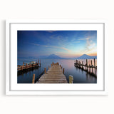 Abstract art print featuring a blend of vivid blue and green tones on a framed white mat, ideal for dining room decor.