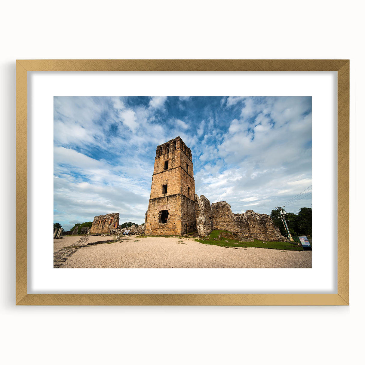 Extra large abstract art print of Central American scenery in gold frame, with textured design.