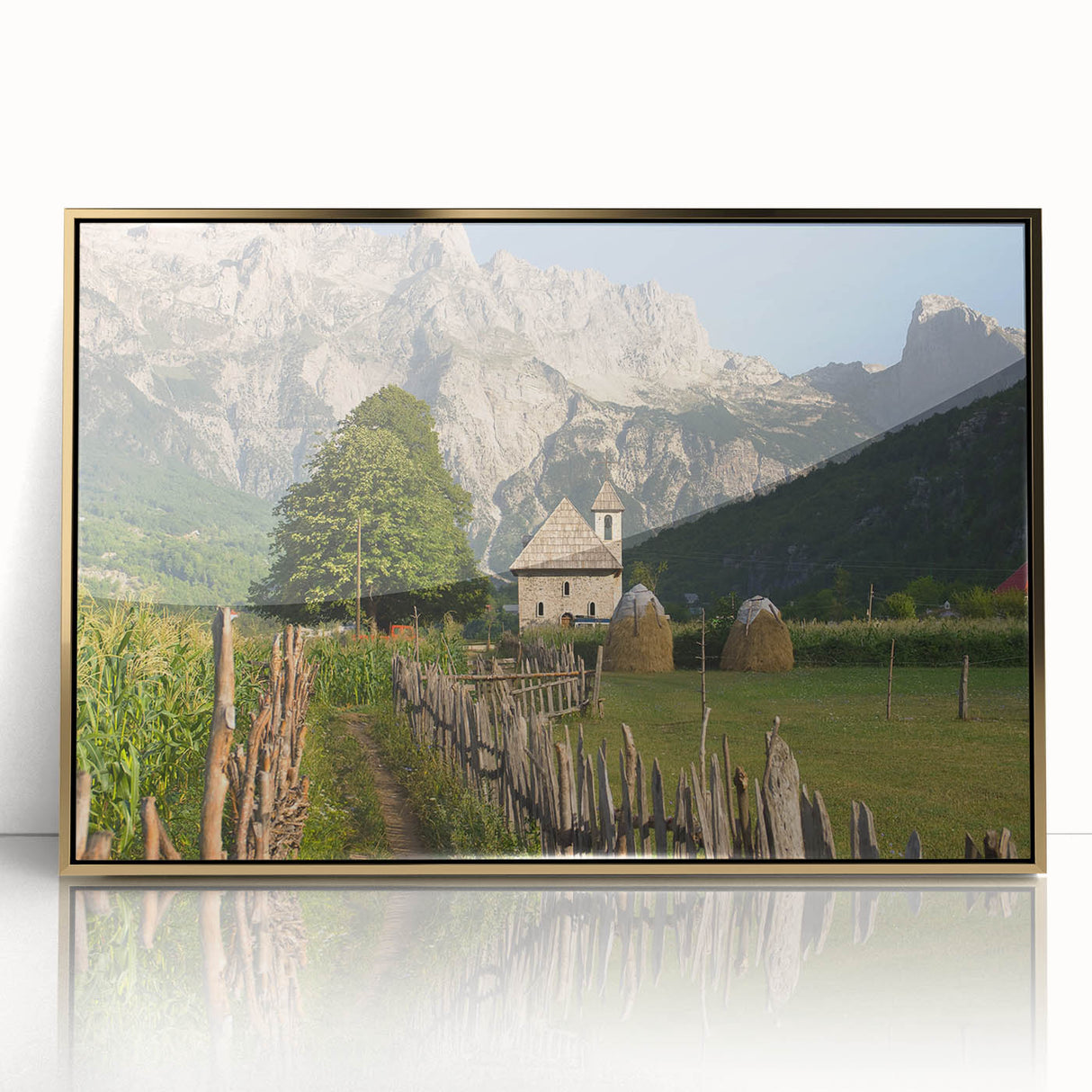 Art deco poster of an Albanian landscape in muted gold and green tones, acrylic framed, suitable for modern nursery decor.