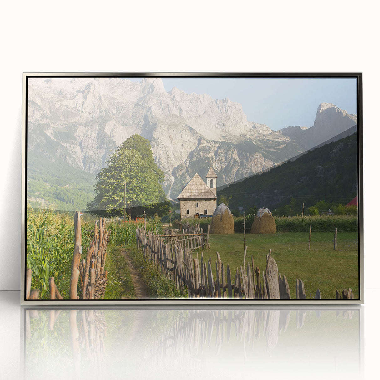 Large art print of an Albanian landscape in mid-century modernist style, featuring muted earth tones on a framed acrylic.