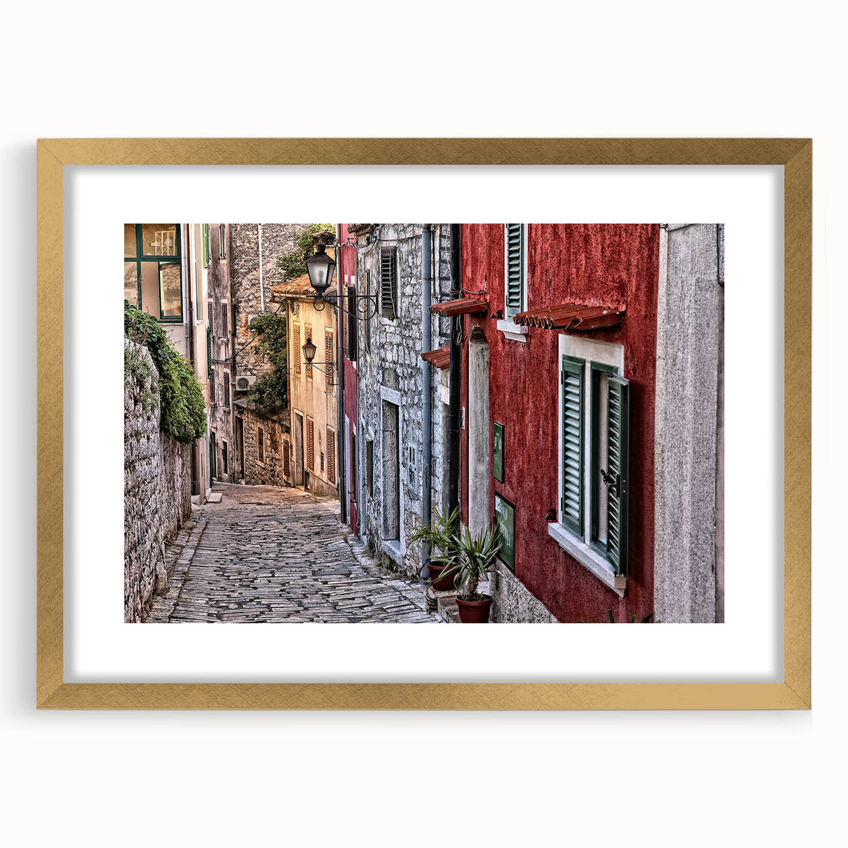 Abstract art print of a Croatian landscape in muted earth tones on a framed canvas, suitable for dining room decor.