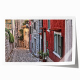 Rolled print of a Croatian landscape featuring vibrant green fields and a clear blue sky.