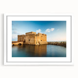 Textured abstract art print depicting a European Cyprus landscape in muted earth tones, framed in white.