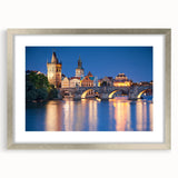 Abstract art print of a European cityscape in muted grays and blues, framed in silver, ideal for dining room decor.