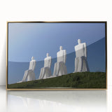 Large art print of a serene Danish landscape in muted green and blue tones, framed in gold acrylic.