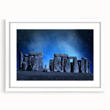 Textured art print of Stonehenge in muted earth tones on a white framed mat, suitable for bedroom decor.