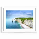 Textured abstract art print of Normandy scenery in muted earth tones, framed with a white mat, suitable for bedroom decor.