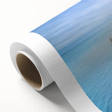 Art deco poster of Normandy scenery on rolled canvas, featuring muted blues and greens, ideal for nursery wall art.