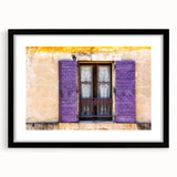 Abstract art print of a colorful, textured European scenery in black frame, ideal for living room decor.