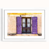 Textured art print depicting an abstract European scenery in muted earth tones, framed with a white mat.