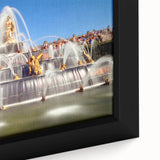 Close-up of textured black wall art depicting Versailles with vibrant, colorful accents on a framed canvas.