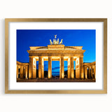 Abstract art print of Berlin skyline in gold frame, featuring muted gray and blue tones, ideal for dining room decor.
