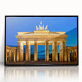Large abstract wall art depicting a stylized Berlin skyline in muted gray and blue tones on a framed acrylic print.