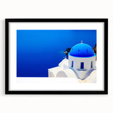 Extra large abstract art print of Santorini, featuring vibrant blue and white tones on a textured canvas, framed in black.