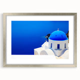 Extra large abstract art print of Santorini with textured appearance in muted blue and white, framed in silver.
