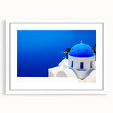 Textured art print of Santorini with abstract blue and white tones, framed in white, ideal for bedroom wall decor.