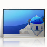 Large art print of Santorini scenery in muted blue and white tones on a silver-framed acrylic.