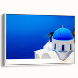 Framed canvas of a colorful Santorini landscape, ideal for brightening a living room wall.