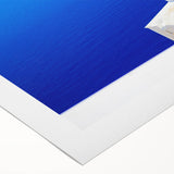 Art deco poster of Santorini with blue and white buildings on rolled canvas, suitable for dining room wall art.