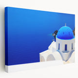 Large canvas print of Santorini landscape in blues and whites, ideal for kitchen wall art.