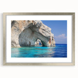 Extra large abstract art print of a textured European scenery, in muted earth tones, framed in silver.