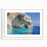 Textured art depicting abstract European scenery in muted blue and white tones on a framed white mat.