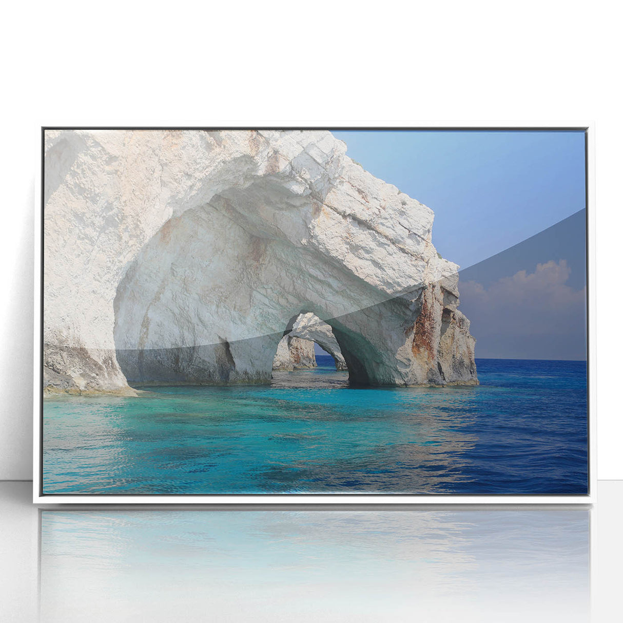 Mid-century modernist art depicting a serene Greek landscape in muted blue and white tones, acrylic print framed in white.
